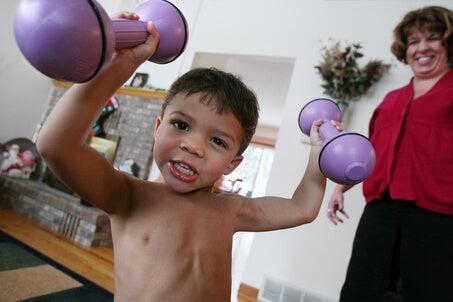 Super strong Liam Hoekstra just after turning 3. Those are 5 lb weights, and he only weighed around 30 lbs at the time.