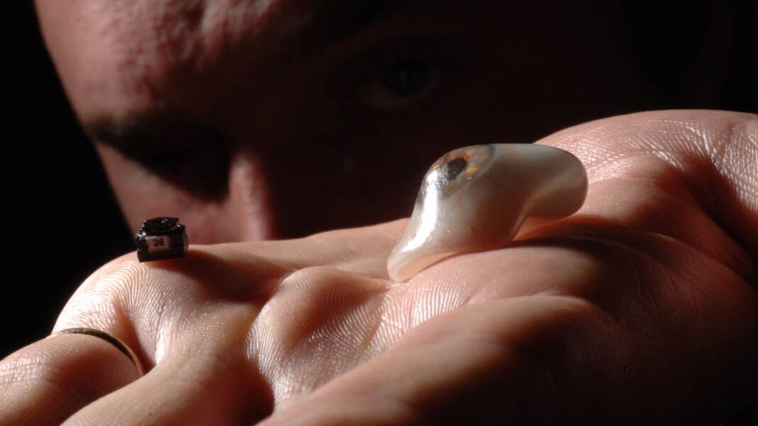 lifestreaming surveillance ethics eyeborg prosthetic eye camera palm of hand face portait