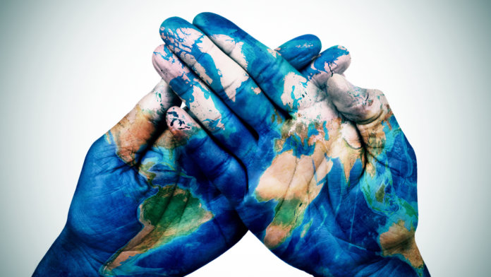 hands-patterned-with-world-earth