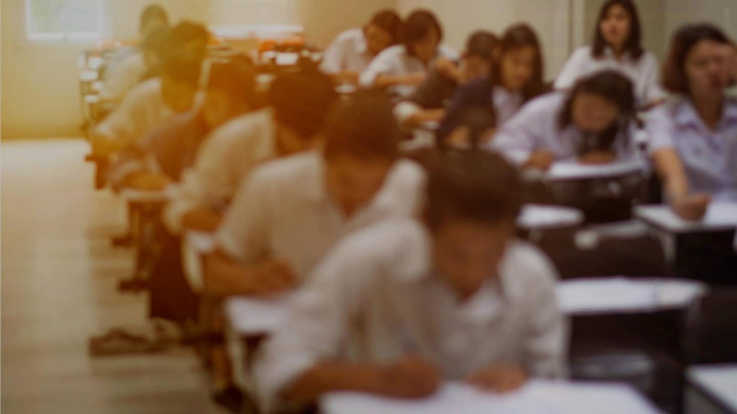 students in exam room blurred