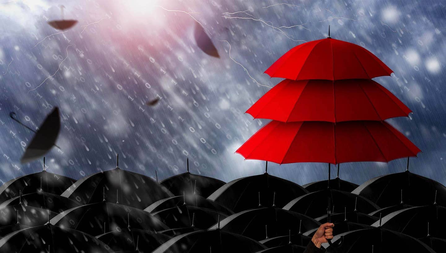 insurance agent holding three layer red umbrella