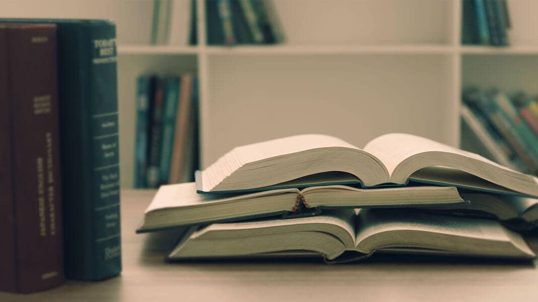 books open and closed in library artificial intelligence ethics