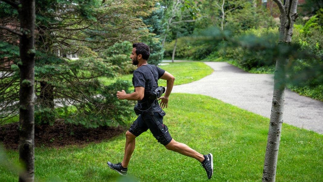 walking uphill man wearing light weight exosuit robotics