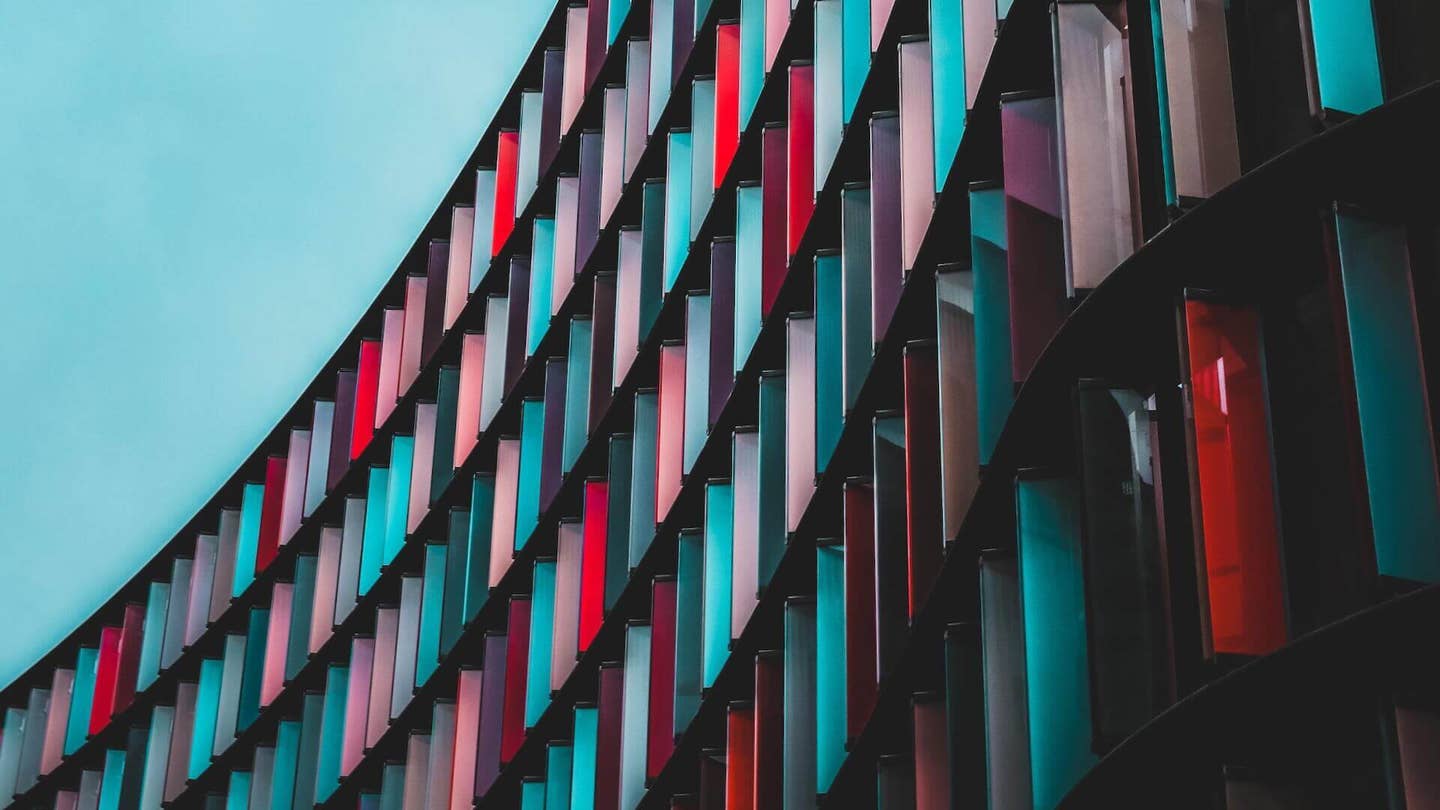 tech stories colorful building blue sky