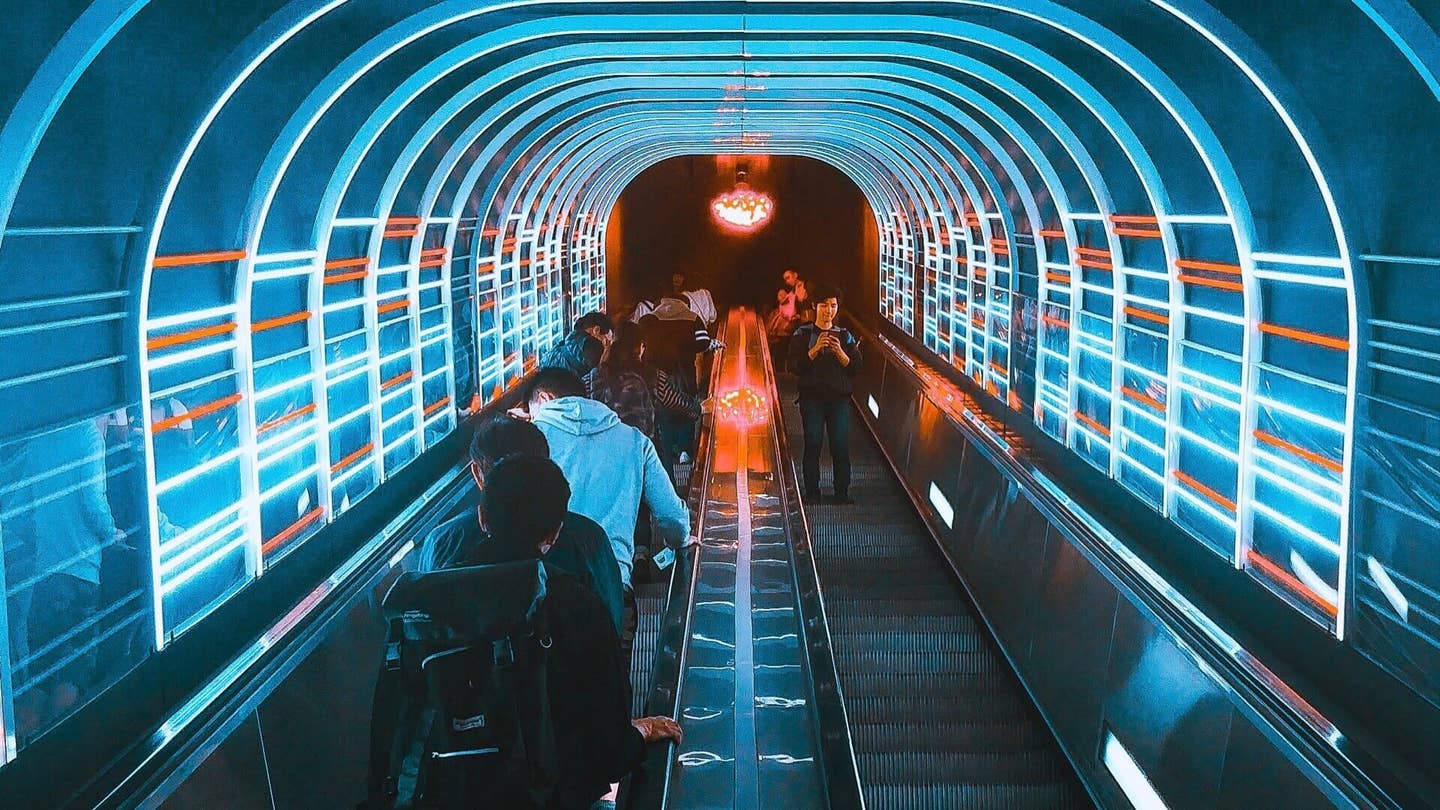 blue white red neon escalator people