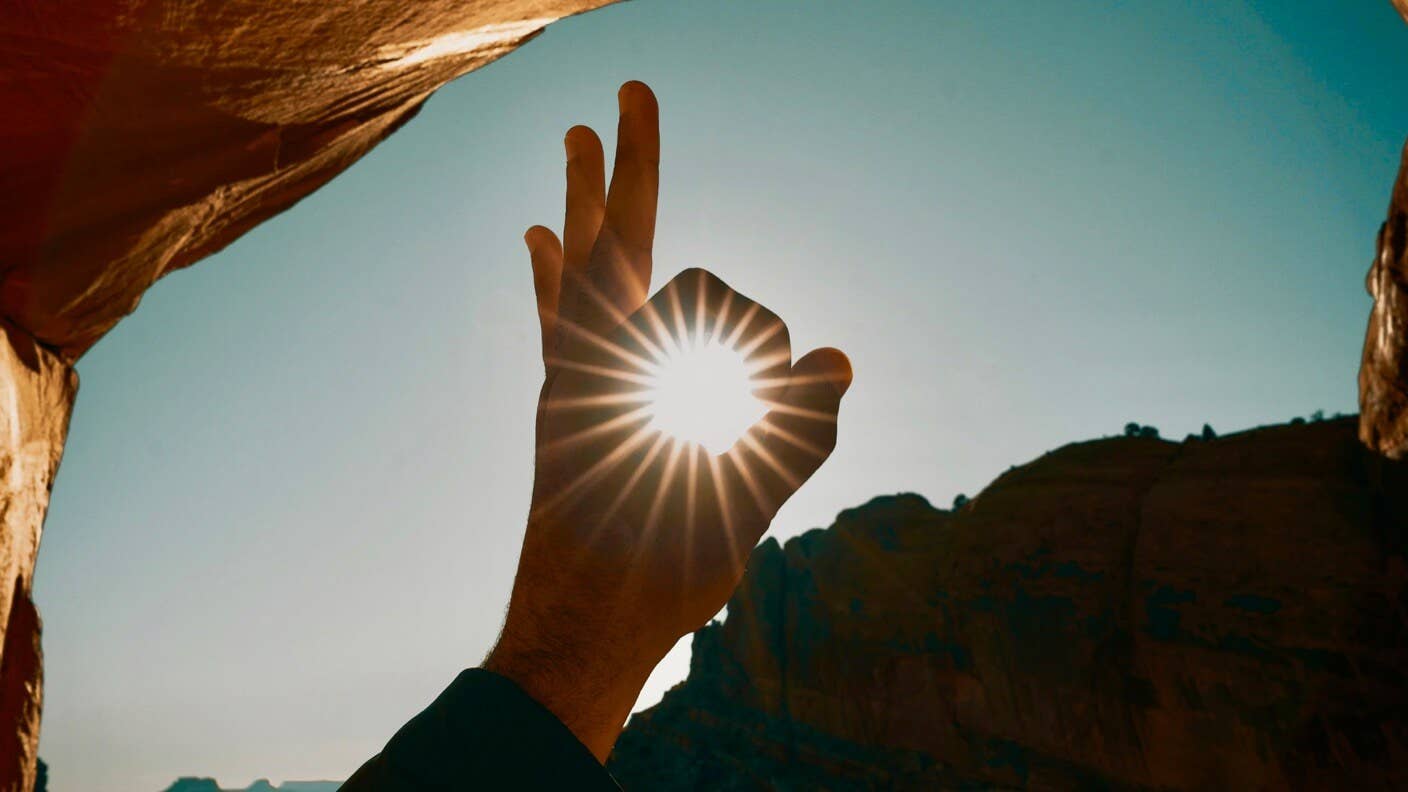 awesome tech stories hand okay sign sun sky sandstone cave