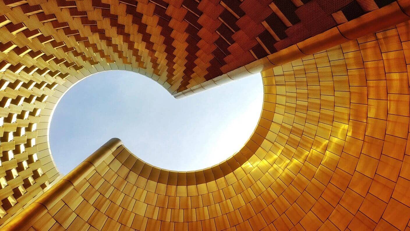 tech stories golden architecture blue sky