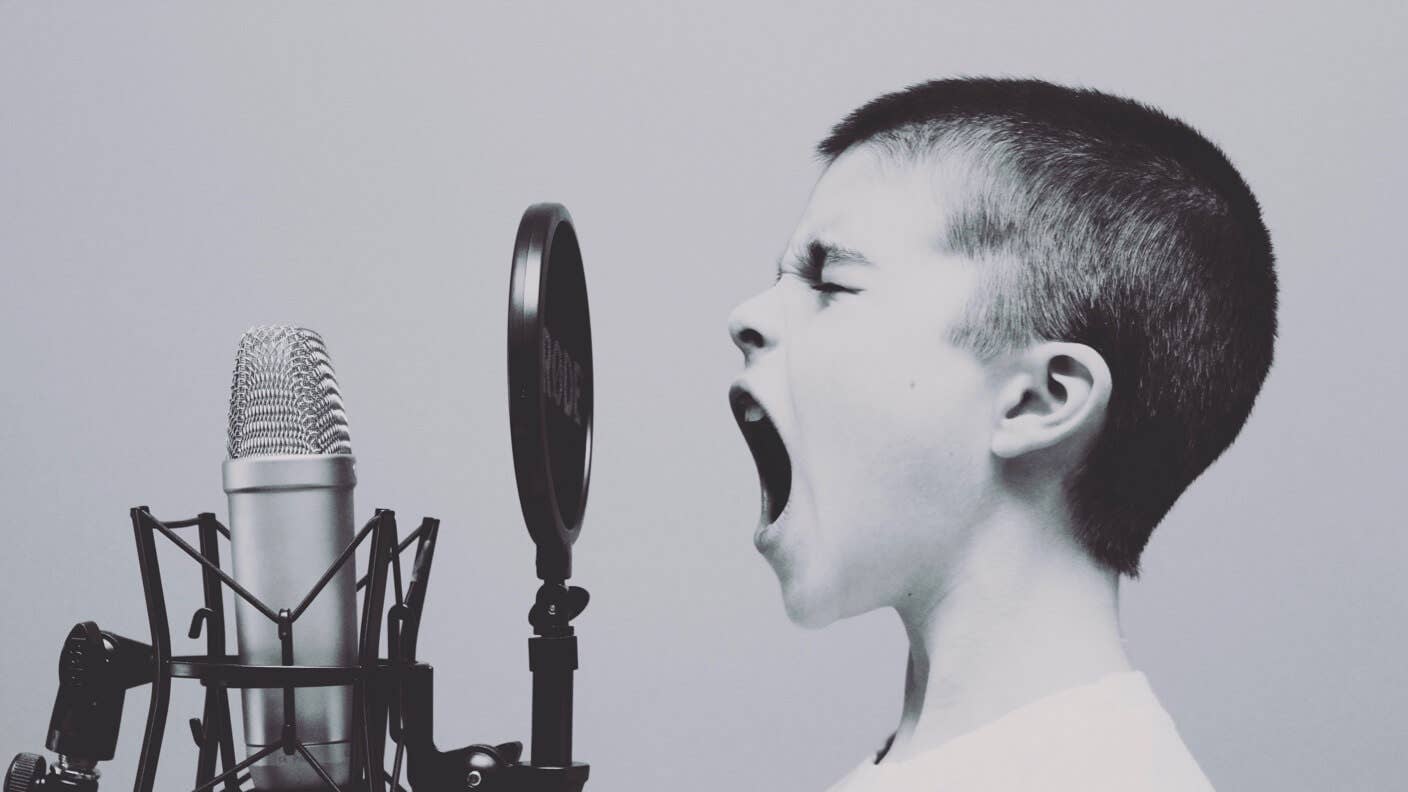 tech stories boy singing microphone