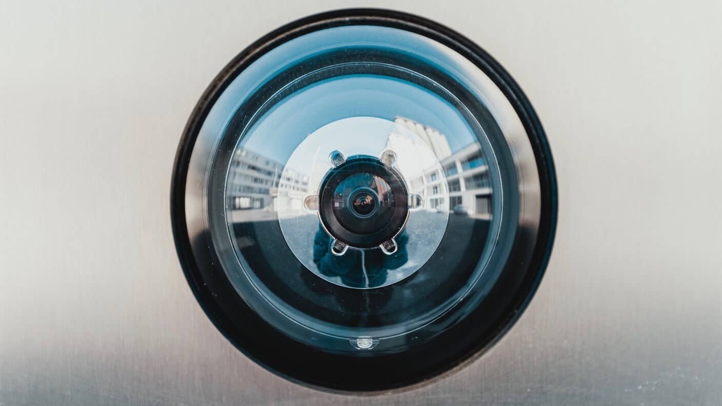 facial recognition and protest camera lens grey silver background