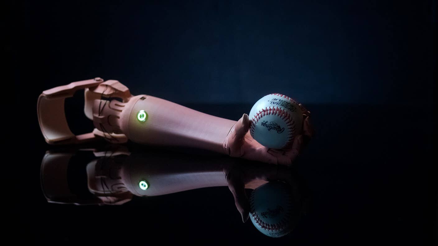 Unlimited Tomorrow 3d printed prosthetics arm on black background