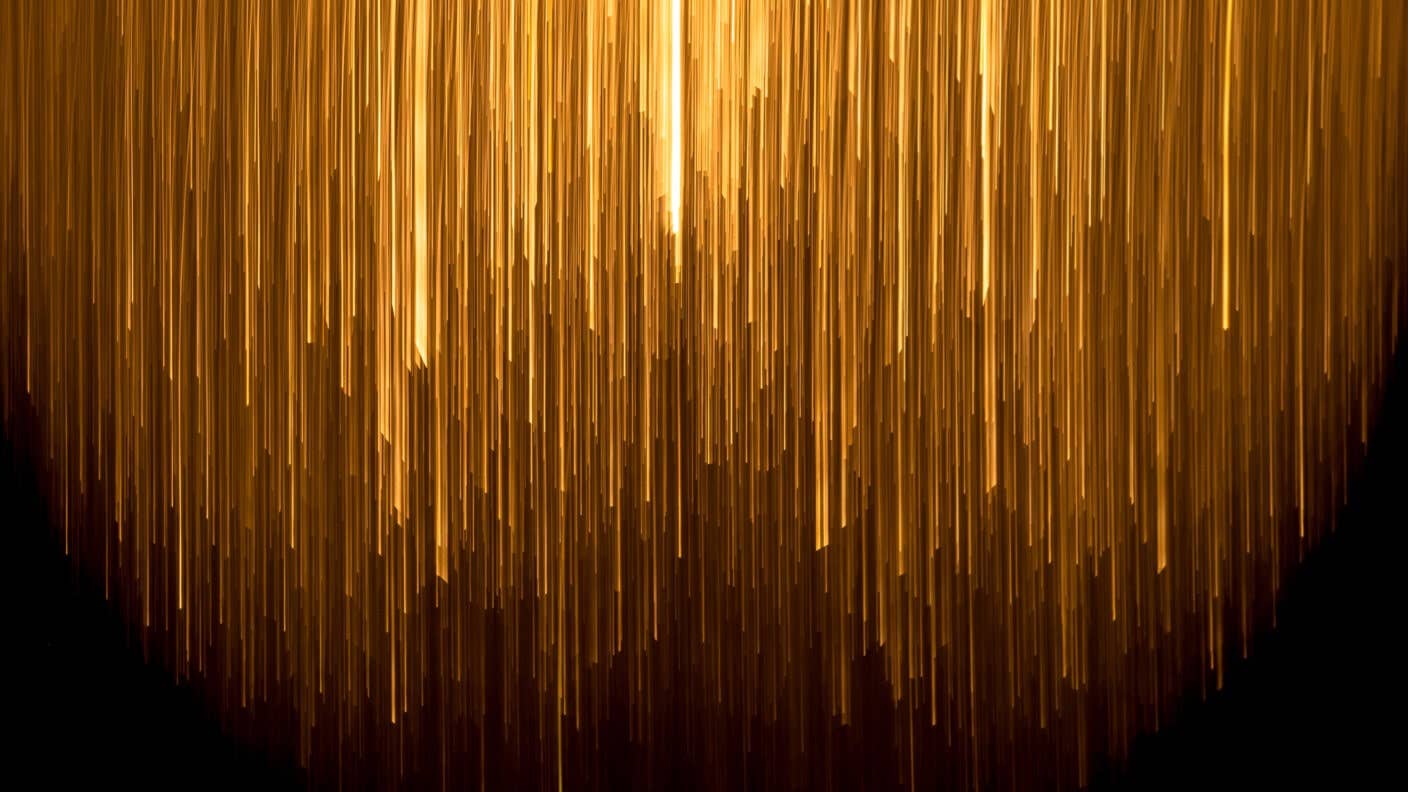 tech stories glowing golden lines light on dark background