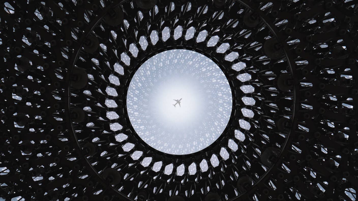 tech stories round patterned architecture skylight airplane blue sky