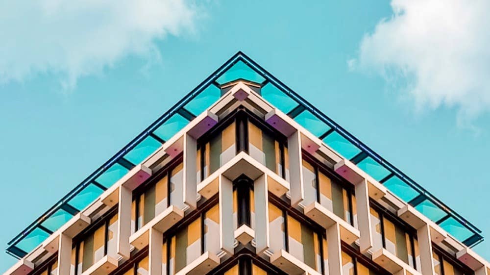 tech stories yellow building blue sky