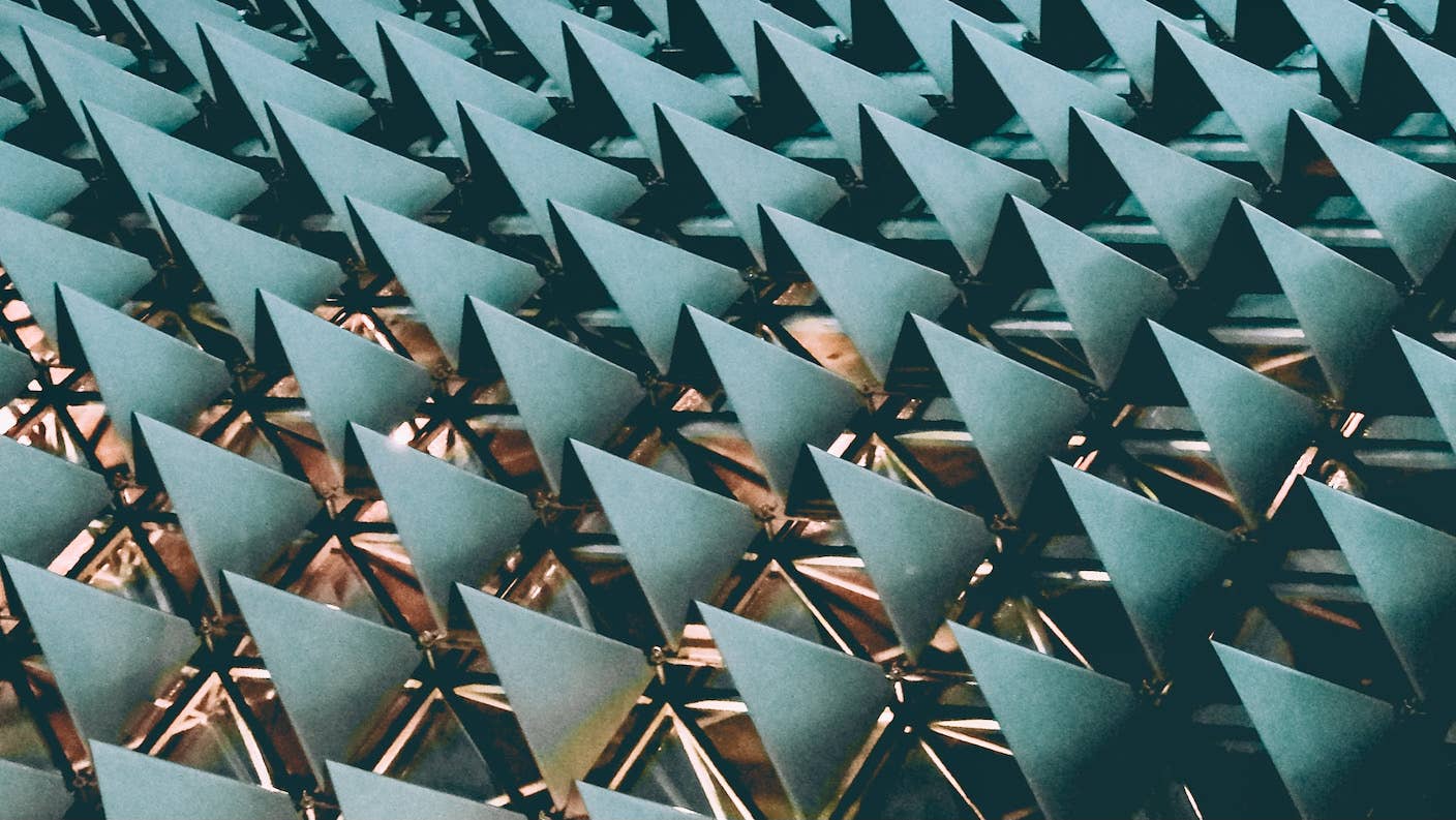 tech stories architecture repeating blue triangles