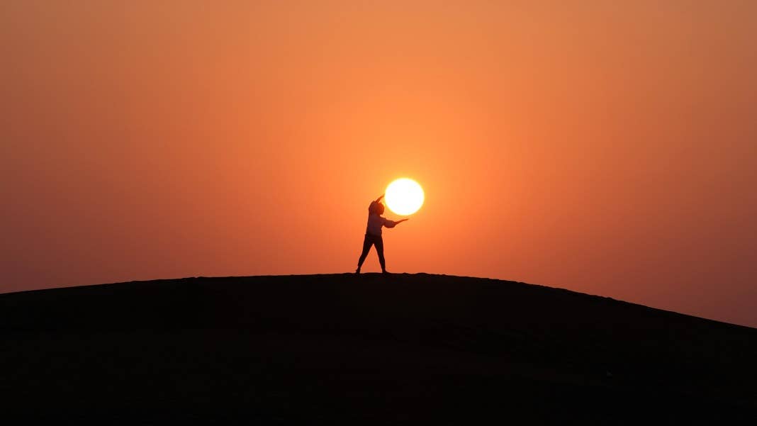 renewables solar power sun person on hill