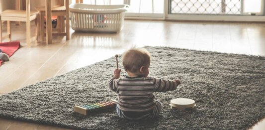 baby playing on floor AI DeepMind Plato