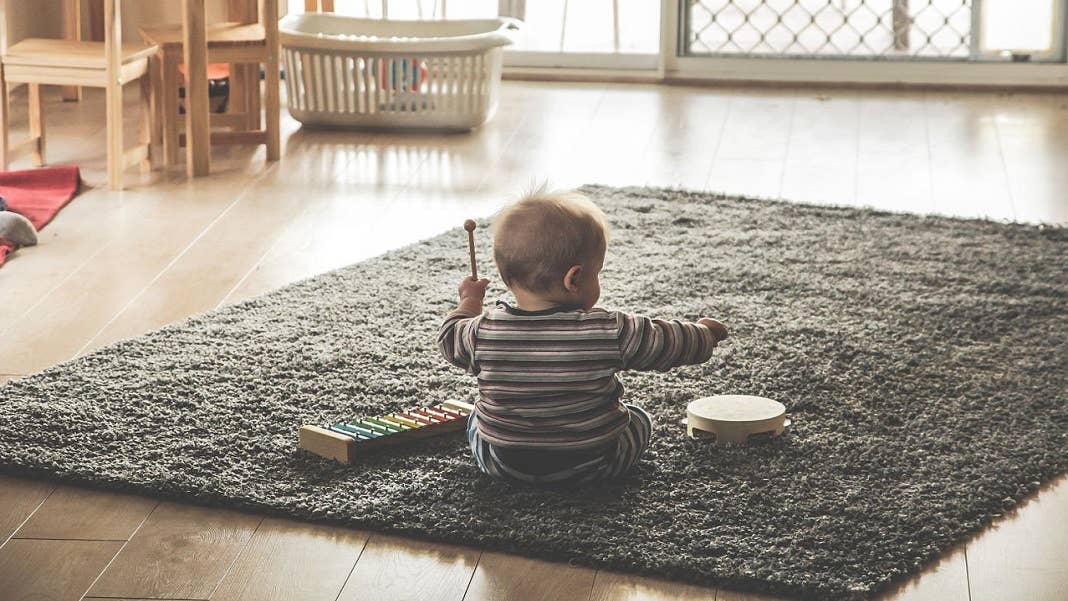baby playing on floor AI DeepMind Plato