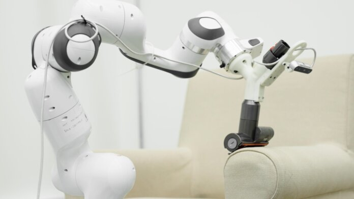household robots chores dyson robot arm vacuuming couch