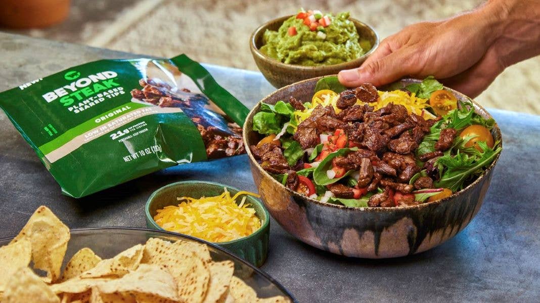 plant-based meat steak on a salad Beyond Meat