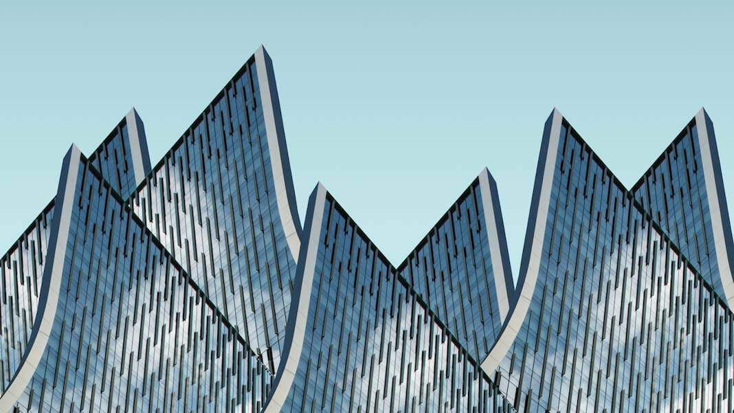 tech stories architectural triangular curves buildings sky