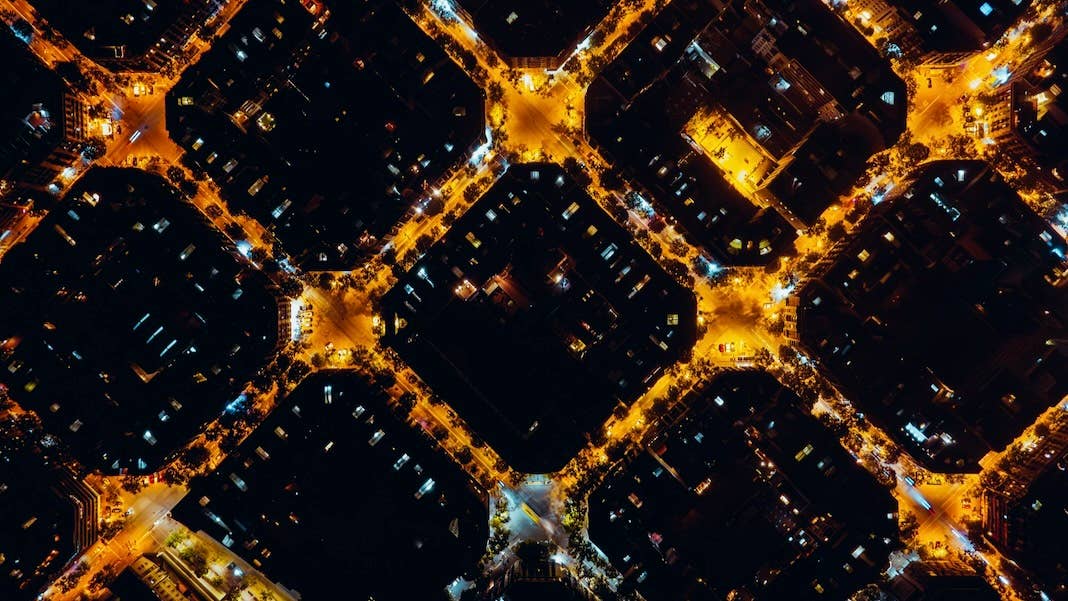 tech stories barcelona city at night aerial view