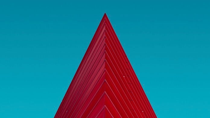 red architecture building triangle blue sky