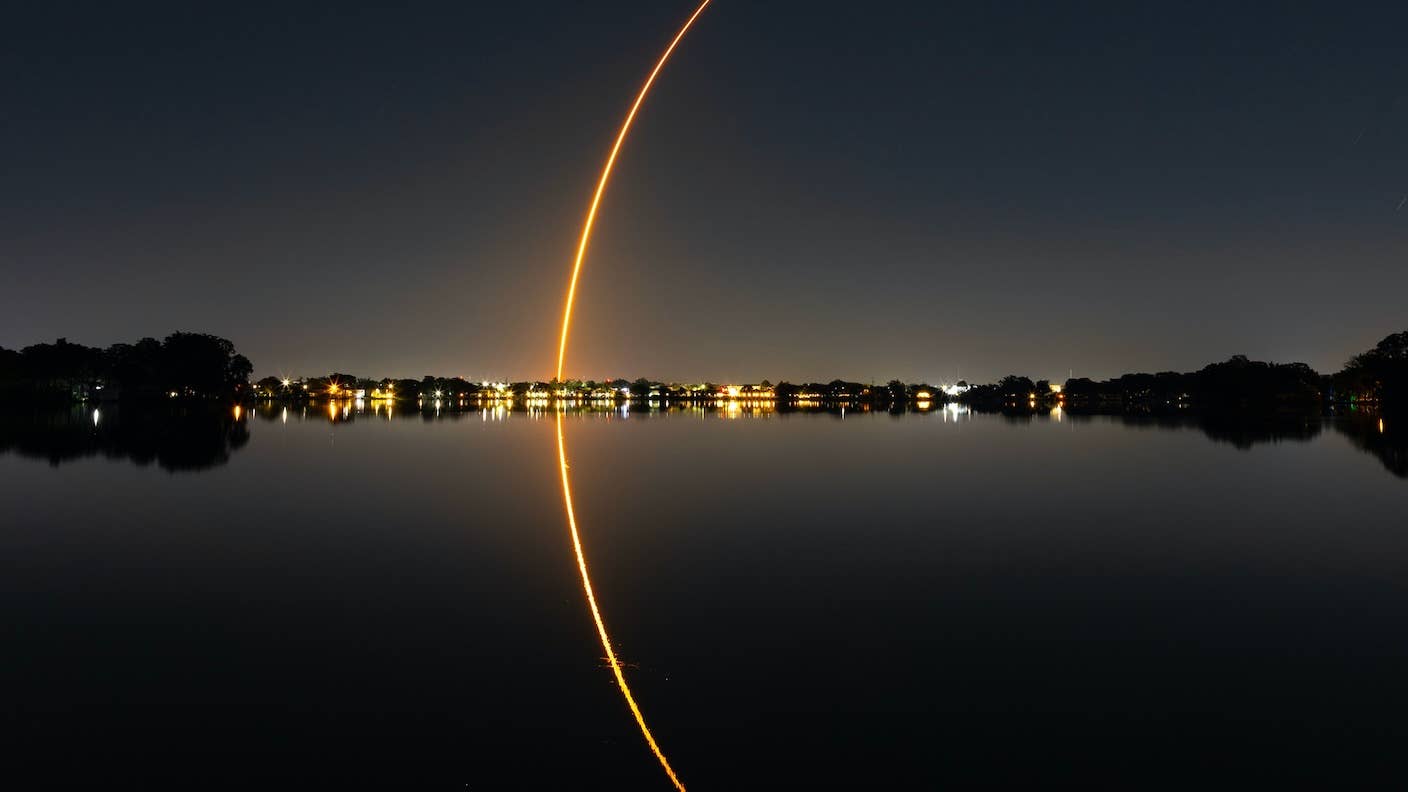 awesome tech stories spacex falcon 9 rocket launch reflection water