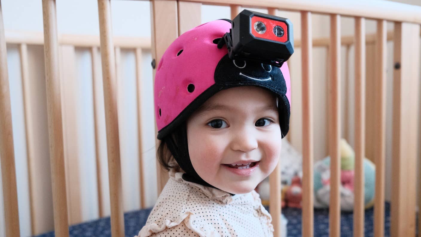 toddler-hand-reaching-for-books