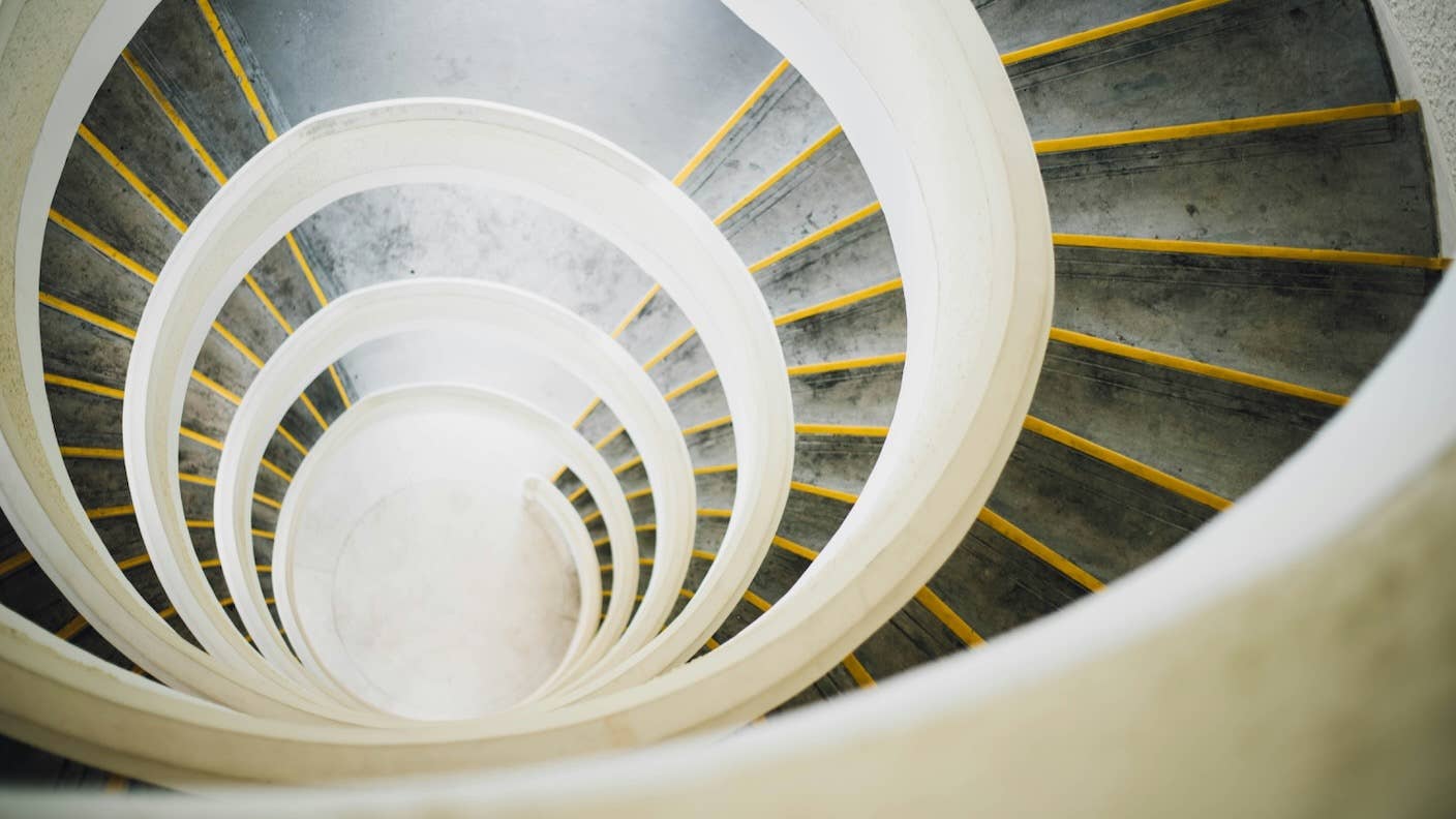 Scaling Up: How Increasing Inputs Has Made Artificial Intelligence More Capable A long spiral staircase with railing