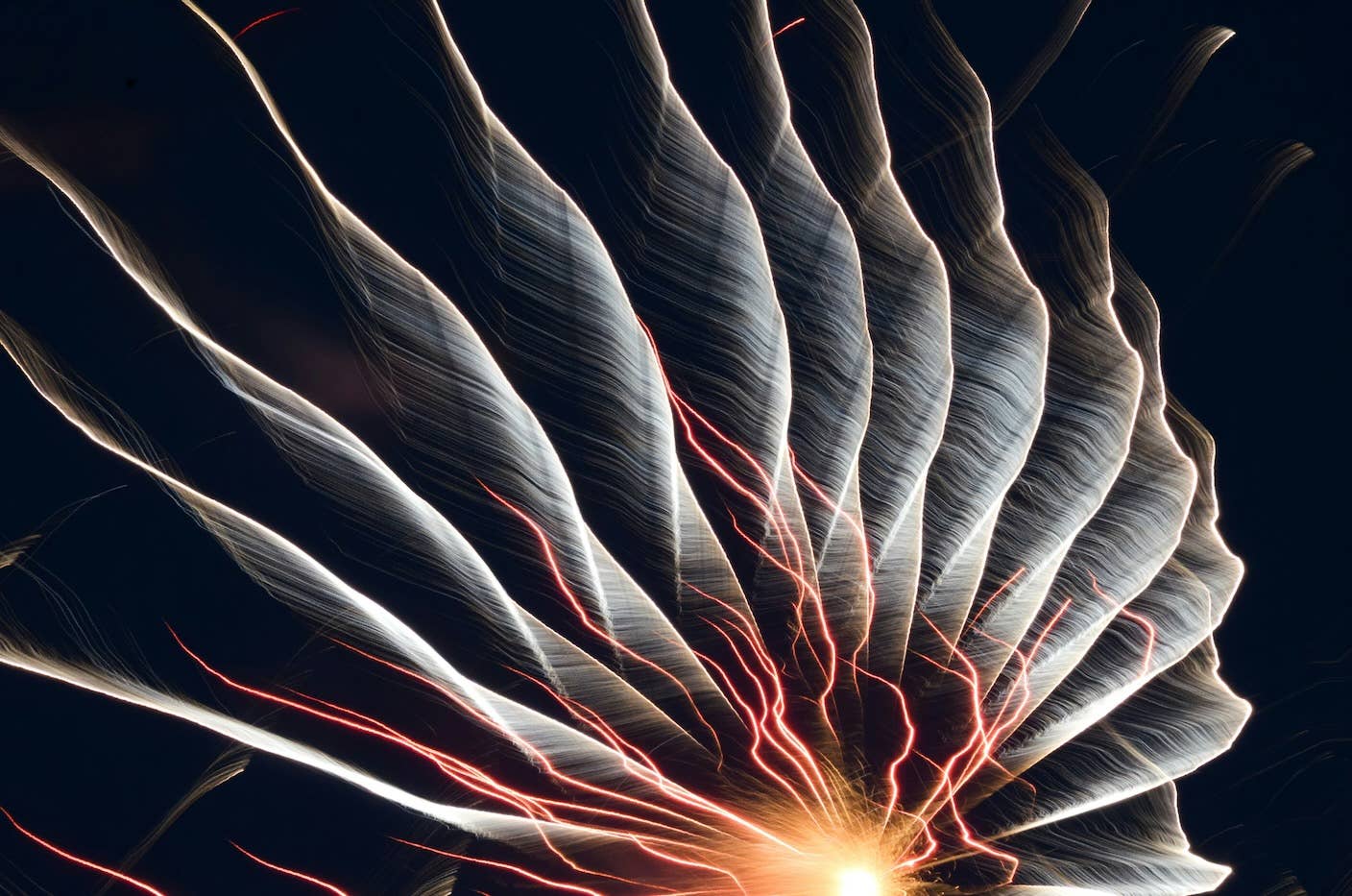 Ghostly spokes rise up from a hub of sparks