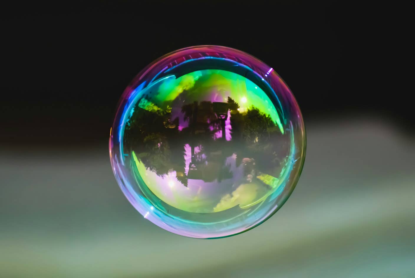 Is the AI Bubble About to Burst? What to Watch for as the Markets Wobble A large bubble floats in the air reflecting its surroundings