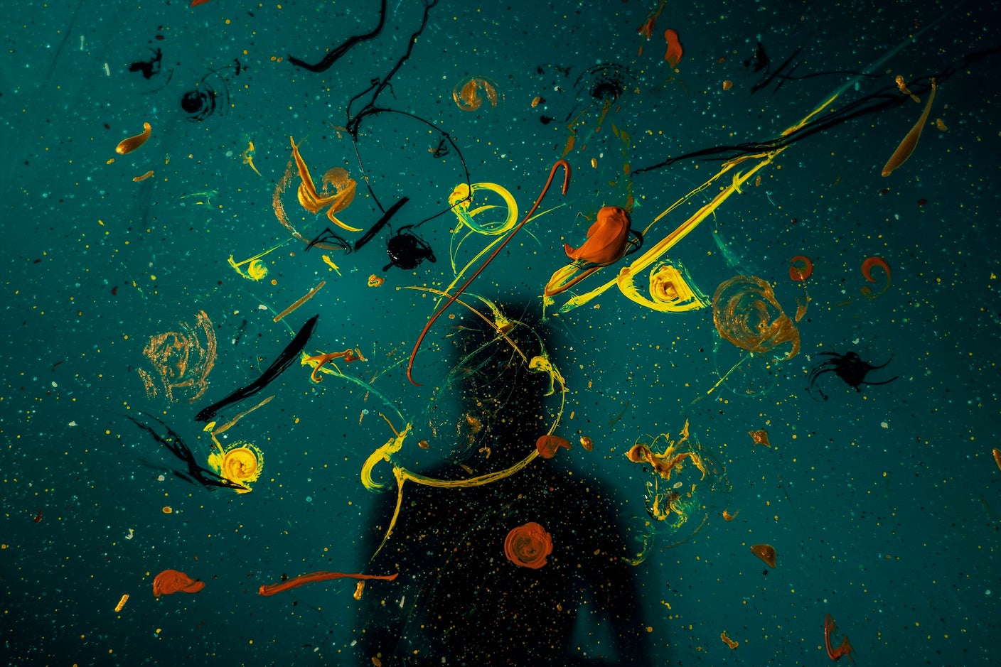 Paint splatters and a shadow of a person