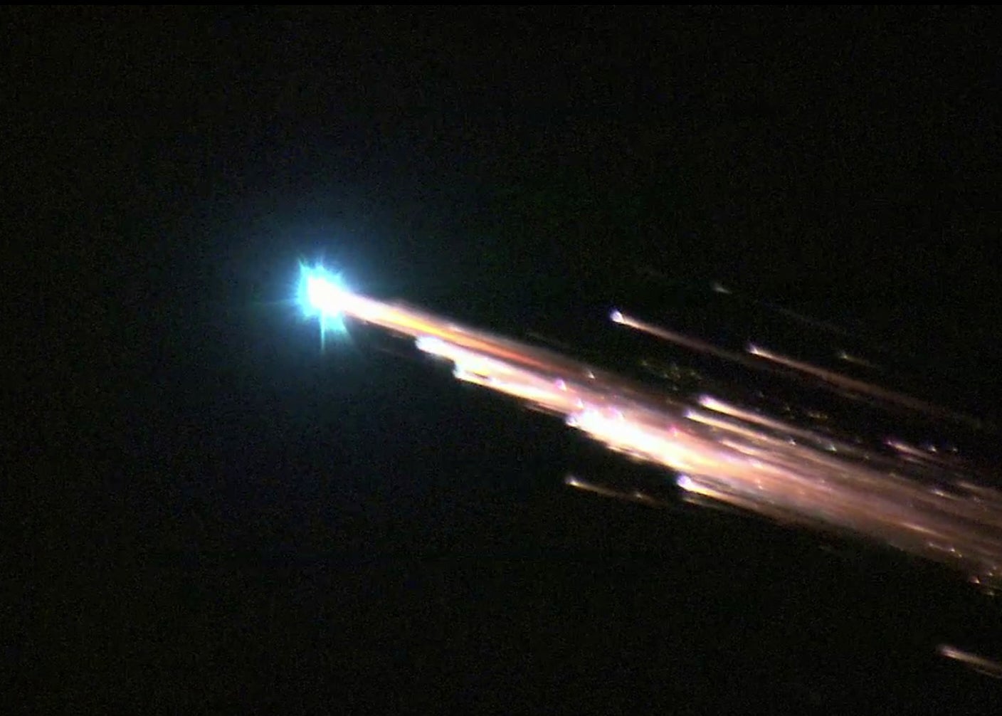 Space debris reenters the atmosphere and burns up as a comet-like fireball