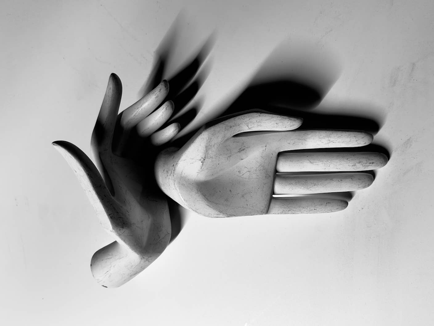 What the Rise of AI Scientists May Mean for Human Research Sculpture of two hands