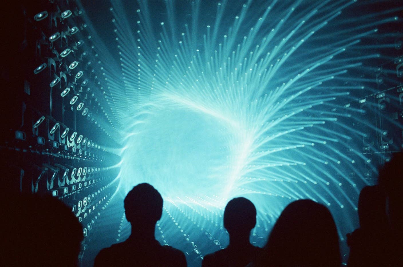 This Week’s Awesome Tech Stories From Around the Web (Through March 14) A group of people watch a vortex of light