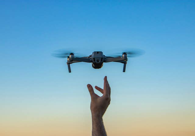 Thousands of Everyday Drone Pilots Are Making a Google Street View From Above A hand launches a drone into the sky