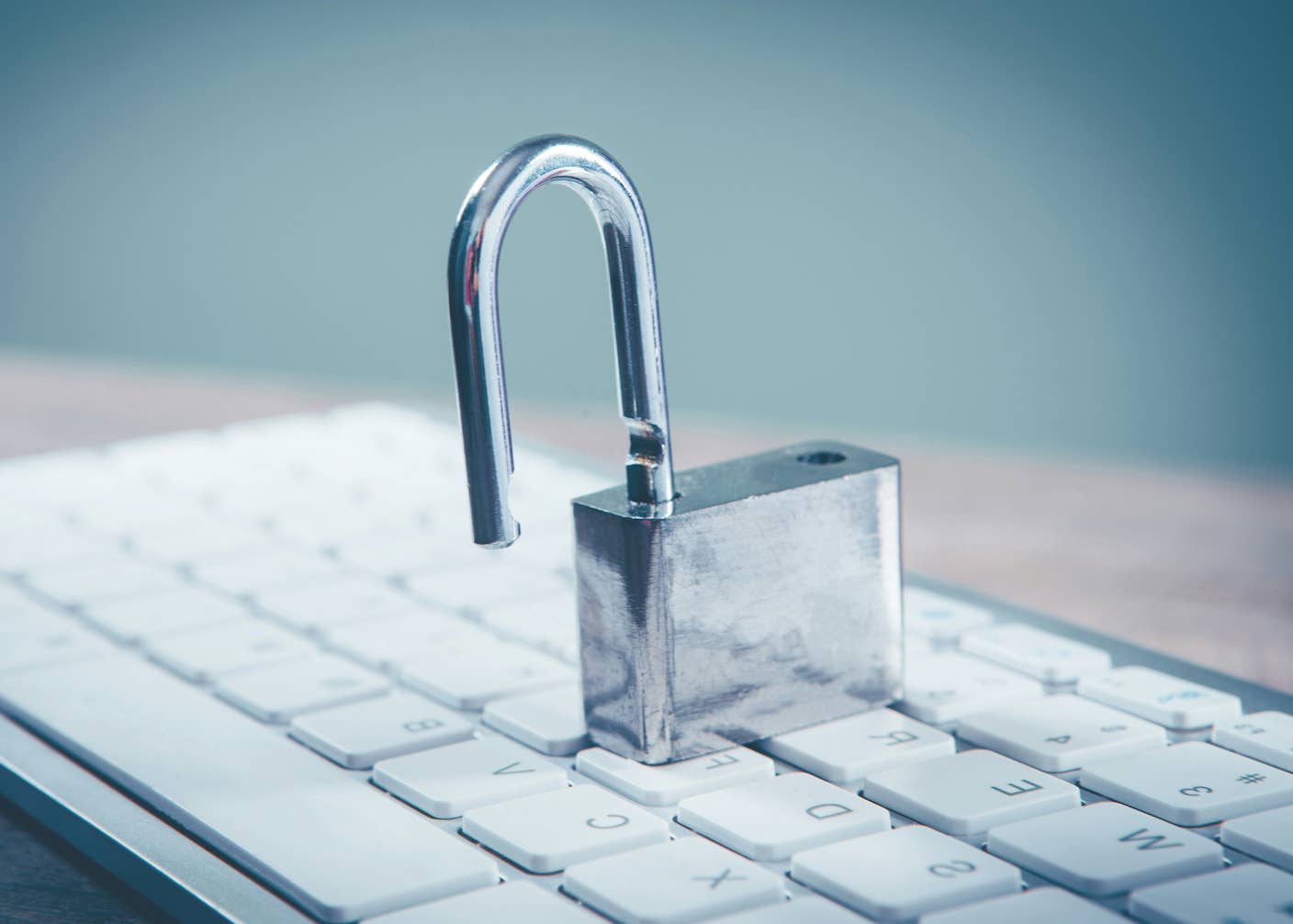 Anthropic’s Mythos AI Uncovered Serious Security Holes in Every Major OS and Browser A silver padlock sits on a computer keyboard unlocked