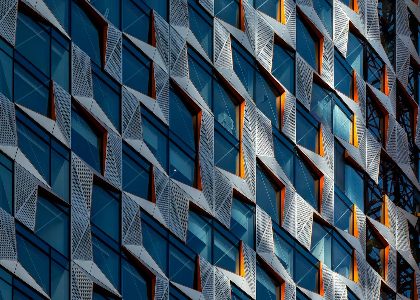 This Week’s Awesome Tech Stories From Around the Web (Through May 9) Repeating pattern of windows with orange trim on a building