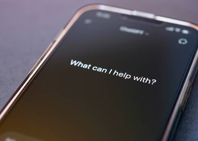 You Probably Wouldn’t Notice if a Chatbot Slipped Ads Into Its Responses A smartphone with the message "What can I help you with" on its display