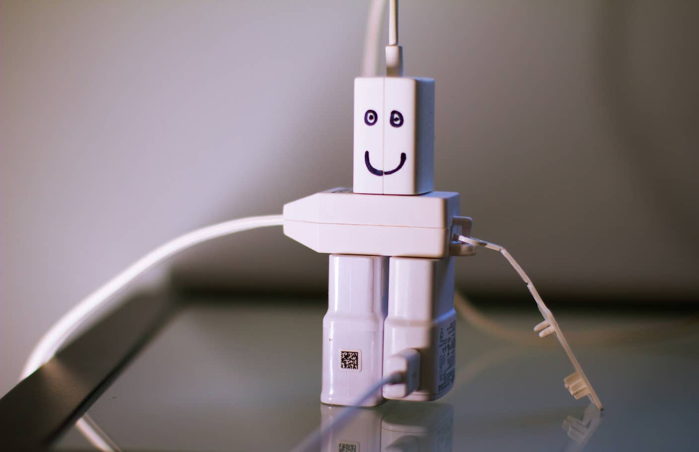 Is Richard Dawkins Right About Claude? No. But It’s Not Surprising AI Chatbots Feel Conscious to Us. Plugs assembled to look like a person