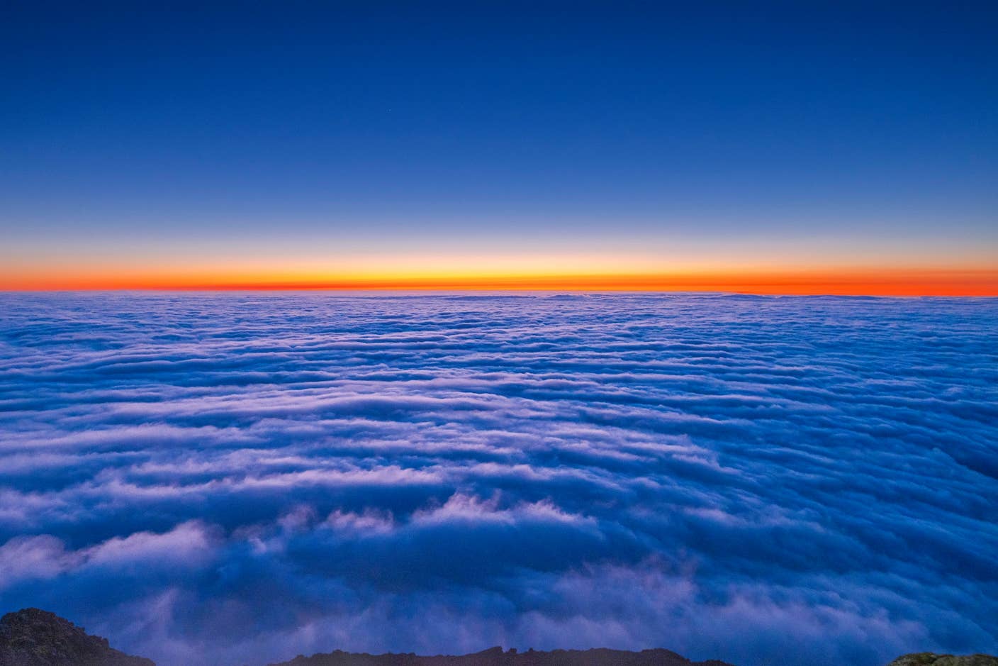 This Week’s Awesome Tech Stories From Around the Web (Through July 11) A beautiful orange sunset over a sea of blue clouds