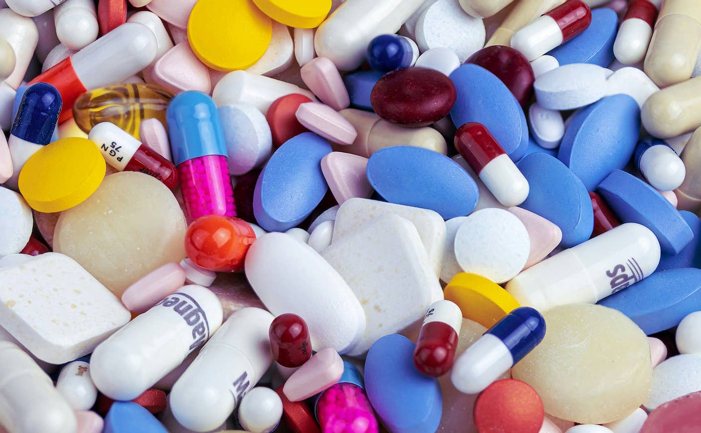 Virtual Biotech Company Puts 37,000 AI Agents to Work on Drug Discovery A colorful pile of pills