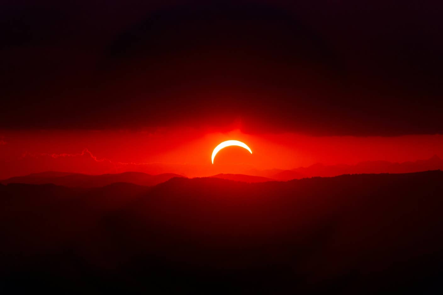This Week’s Awesome Tech Stories From Around the Web (Through September 19) A partial solar eclipse over dark mountains