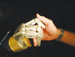 The WAM robot arm from Barrett Technology works well with humans, but where are the robots that play well with others?