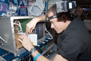 Tom Marshburn works in the ISS lab, Destiny.