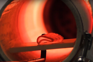 Kiln firing a 3D printed ceramic part. (Image Credit: HRL Laboratories/YouTube)