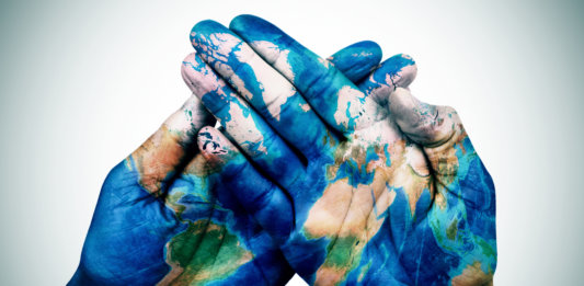 hands-patterned-with-world-earth