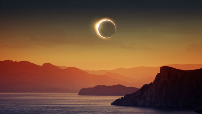 total-solar-eclipse-ocean-sunset-reality
