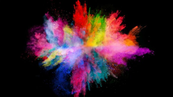 innovation creativity explosion colored powder on black background