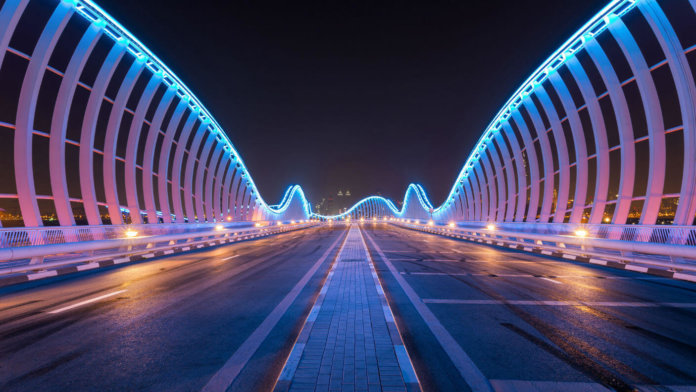 6ds-of-exponential-organizations-neon-bridge-night-dubai-uae-meydan